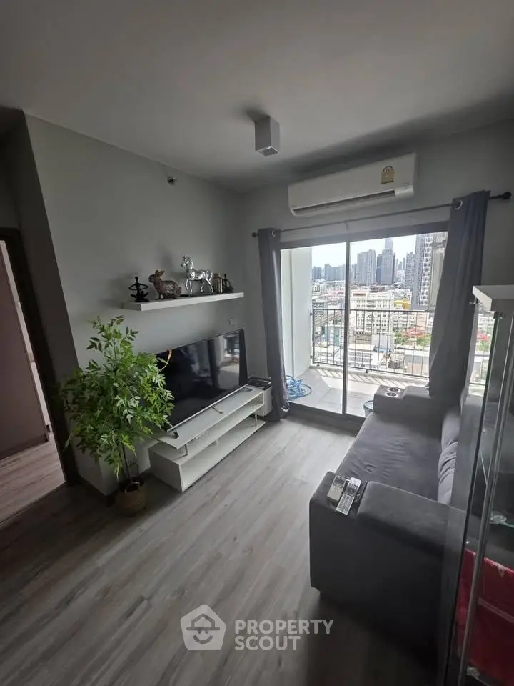 Modern living room with balcony view in high-rise apartment