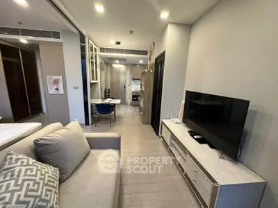 Modern living room with open kitchen layout and stylish decor