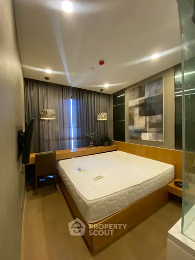 Modern bedroom with stylish decor and ample natural light