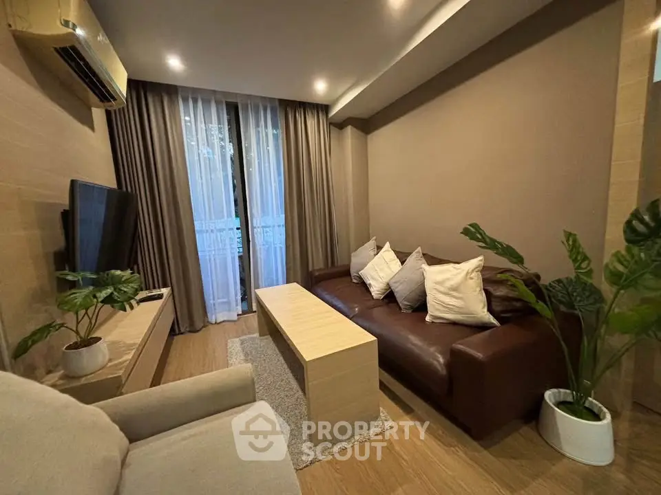 Cozy living room with modern decor, featuring a comfortable sofa, stylish coffee table, and lush indoor plants.