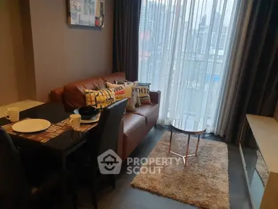 Cozy living room with city view, modern decor, and comfortable seating.