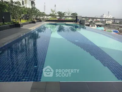 Luxurious rooftop infinity pool with stunning city views and modern design.