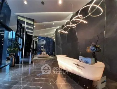 Luxurious modern lobby with elegant lighting and sleek marble flooring