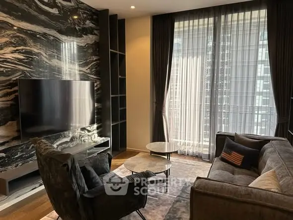 Luxurious living room with modern decor and large windows offering city views.