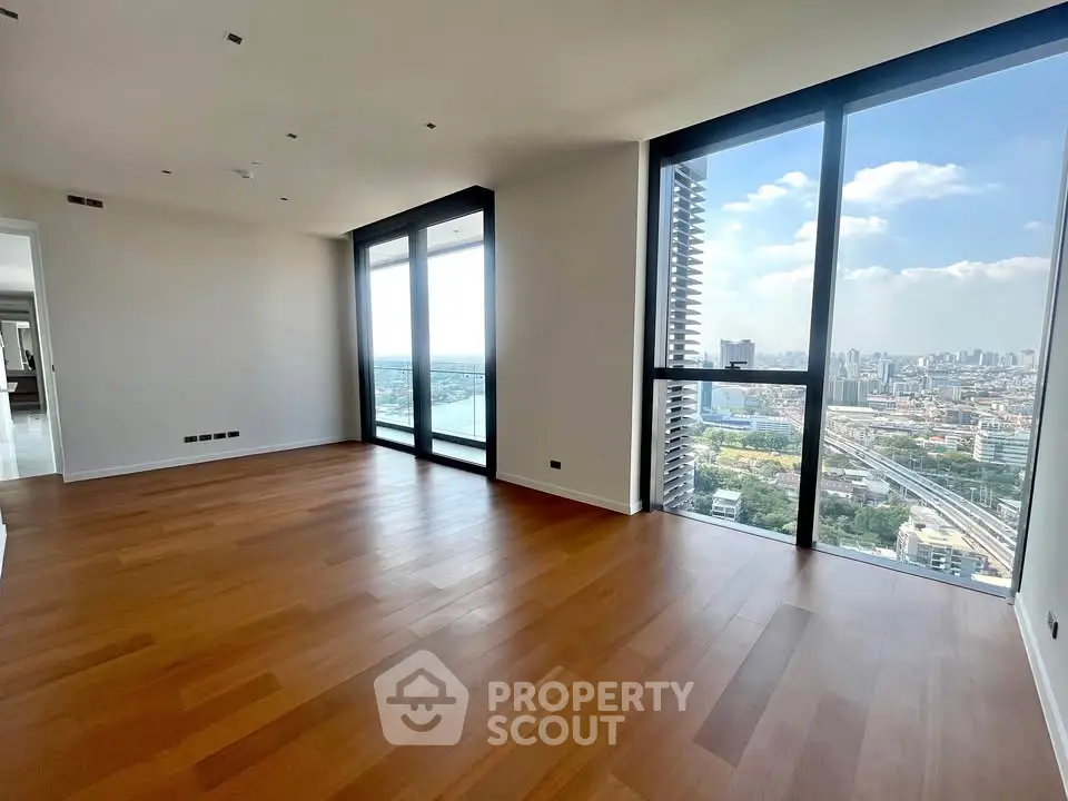 Spacious modern living room with stunning city view and large windows