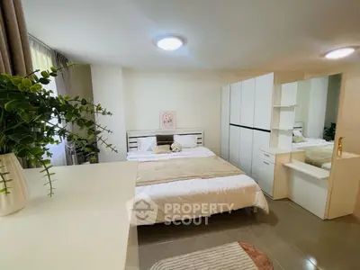 Cozy bedroom with modern decor and ample storage space