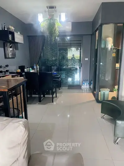 Modern living room with sleek design and glass partition