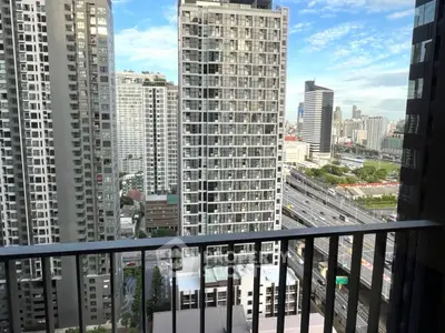 Stunning cityscape view from high-rise balcony in modern urban apartment.