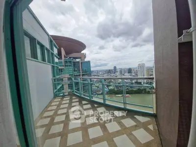 Stunning cityscape view from spacious balcony in high-rise apartment