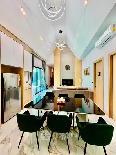 Luxurious modern living room with high ceilings, elegant dining area, and stylish lighting fixtures.