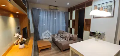 Modern living room with stylish furniture and elegant lighting in a cozy apartment.
