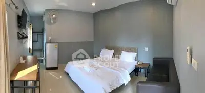 Cozy bedroom with modern decor and comfortable furnishings