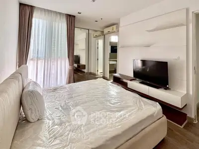 Modern bedroom with large window and stylish decor in urban apartment