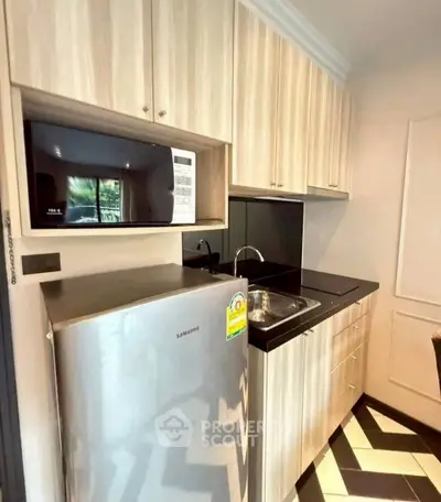 Modern kitchen with sleek cabinetry and stainless steel appliances