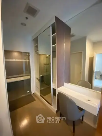 Modern interior with sleek closet and vanity in a stylish apartment