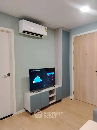 Modern living room with air conditioner and TV in stylish apartment