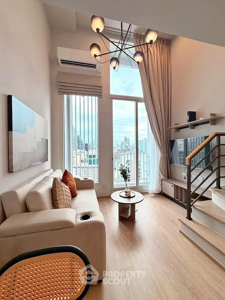 Modern living room with city view, stylish decor, and elegant lighting in a high-rise apartment.