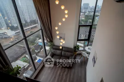 Stunning high-rise living room with floor-to-ceiling windows and city view