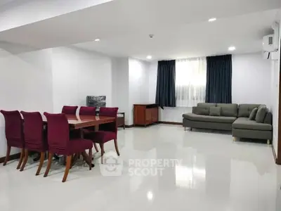 Spacious modern living room with elegant dining area and stylish furniture