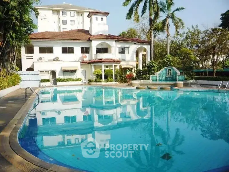 Luxurious villa with stunning pool and lush greenery, perfect for relaxation and entertainment.