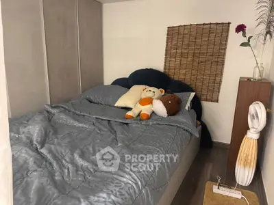 Cozy bedroom with plush bedding and decorative accents for a warm ambiance.