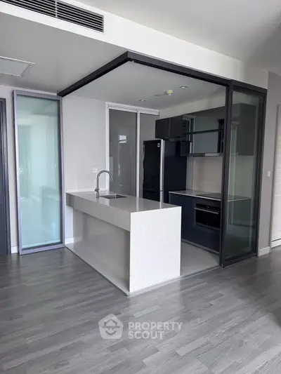 Modern kitchen with sleek design and open layout in a contemporary apartment.
