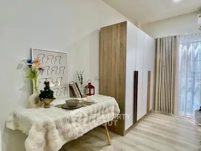 Chic modern interior with stylish decor and ample storage in a cozy living space.