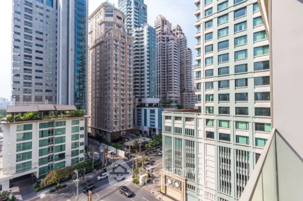 Stunning urban cityscape view from high-rise balcony in vibrant downtown area.