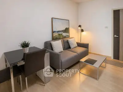 Modern living room with cozy sofa and stylish decor in a contemporary apartment.