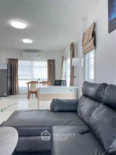 Spacious living room with modern furniture and natural light