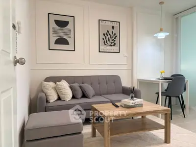 Stylish modern living room with gray sofa and chic decor