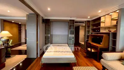 Luxurious bedroom with elegant wooden flooring and stylish furnishings