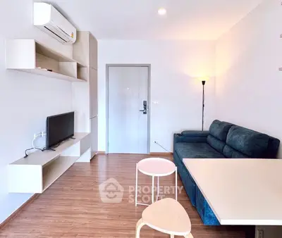 Modern living room with sleek furniture and air conditioning, perfect for comfortable urban living.