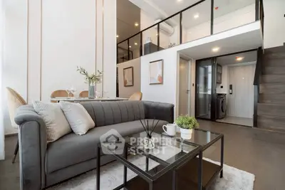 Modern duplex living room with stylish decor and open layout