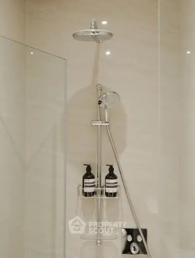 Modern bathroom shower with sleek fixtures and elegant tile design
