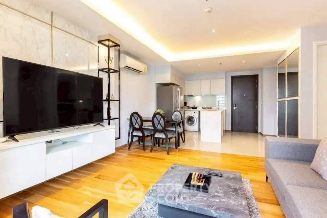 Modern open-plan living room with sleek kitchen and stylish decor