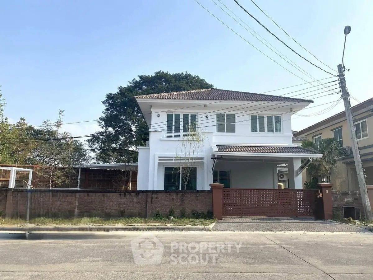 Charming two-story house with spacious yard and modern design in a serene neighborhood.