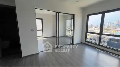Spacious modern apartment with large windows and city view