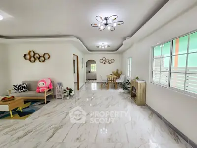 Spacious modern living room with elegant lighting and marble flooring