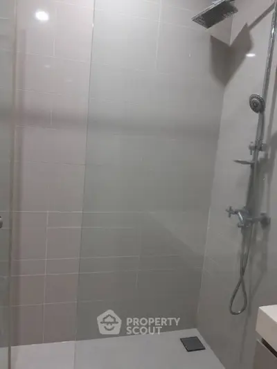 Modern bathroom with sleek shower design and glass partition