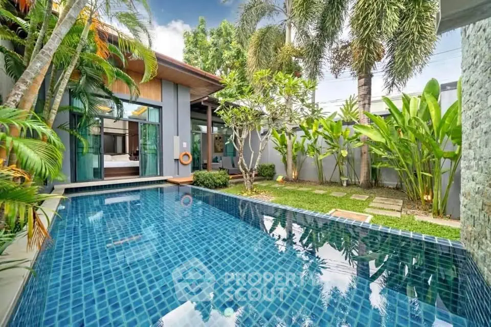 Luxurious tropical villa with private pool and lush garden, perfect for serene living.