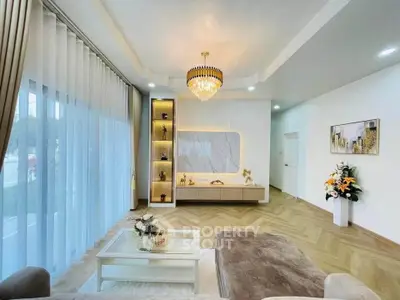 Luxurious living room with elegant chandelier and modern decor