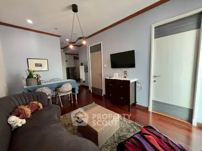 Stylish living room with modern decor and cozy seating area in a contemporary apartment.