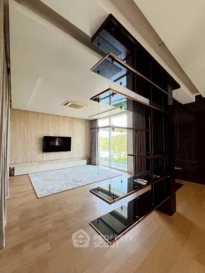 Spacious modern living room with sleek design and large windows