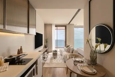 Luxurious open-plan kitchen and living room with stunning ocean view, modern decor, and elegant furnishings.