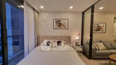 Luxurious modern bedroom with elegant decor and large windows offering stunning views.