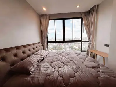 Spacious bedroom with stunning city view and modern decor