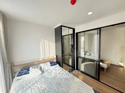 Modern bedroom with glass partition and natural light
