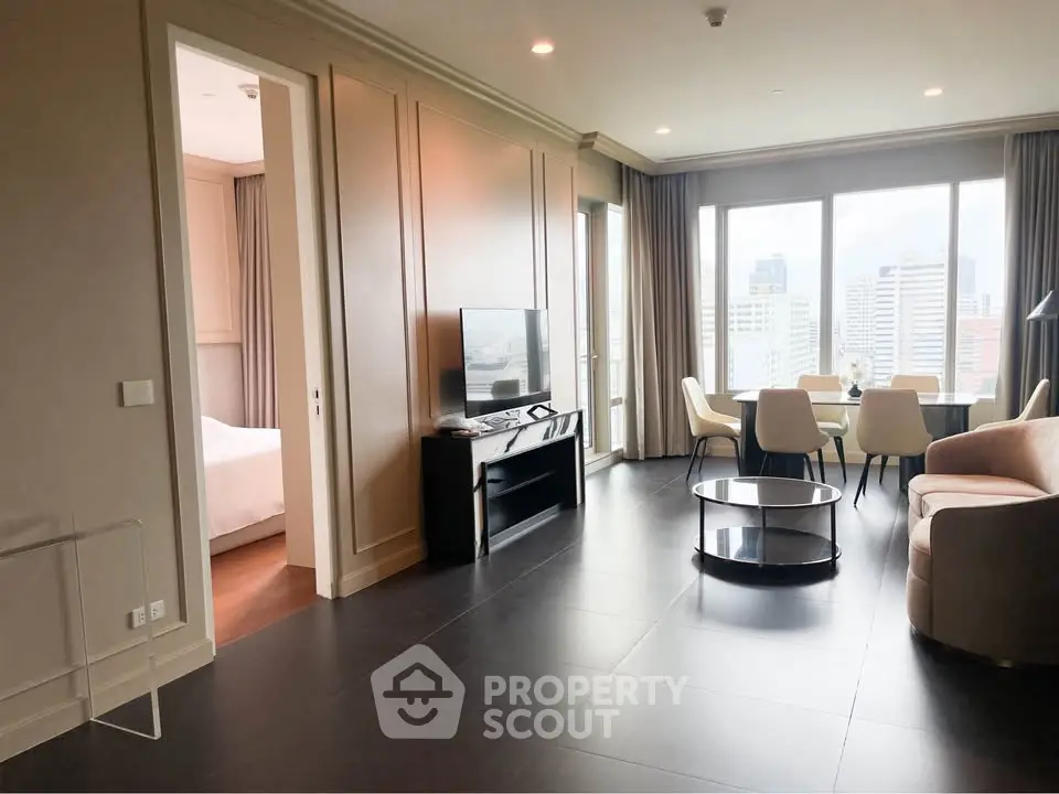 Spacious modern living room with city view, open layout, and elegant furnishings.