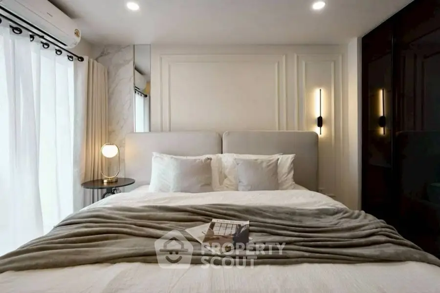 Luxurious bedroom with modern lighting and elegant decor